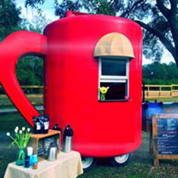 Giant Red Mug on Wheels